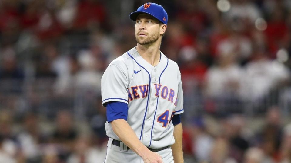 Sep 30, 2022;  Atlanta, Georgia, USA;  New York Mets starting pitcher Jacob deGrom (48) walks off the mound against the Atlanta Braves in the second inning at Truist Park.