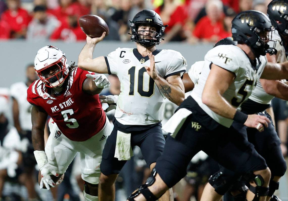 Wake Forest quarterback Sam Hartman (10) throws during the first half of N.C. State’s game against Wake Forest at Carter-Finley Stadium in Raleigh, N.C., Saturday, Nov. 5, 2022.