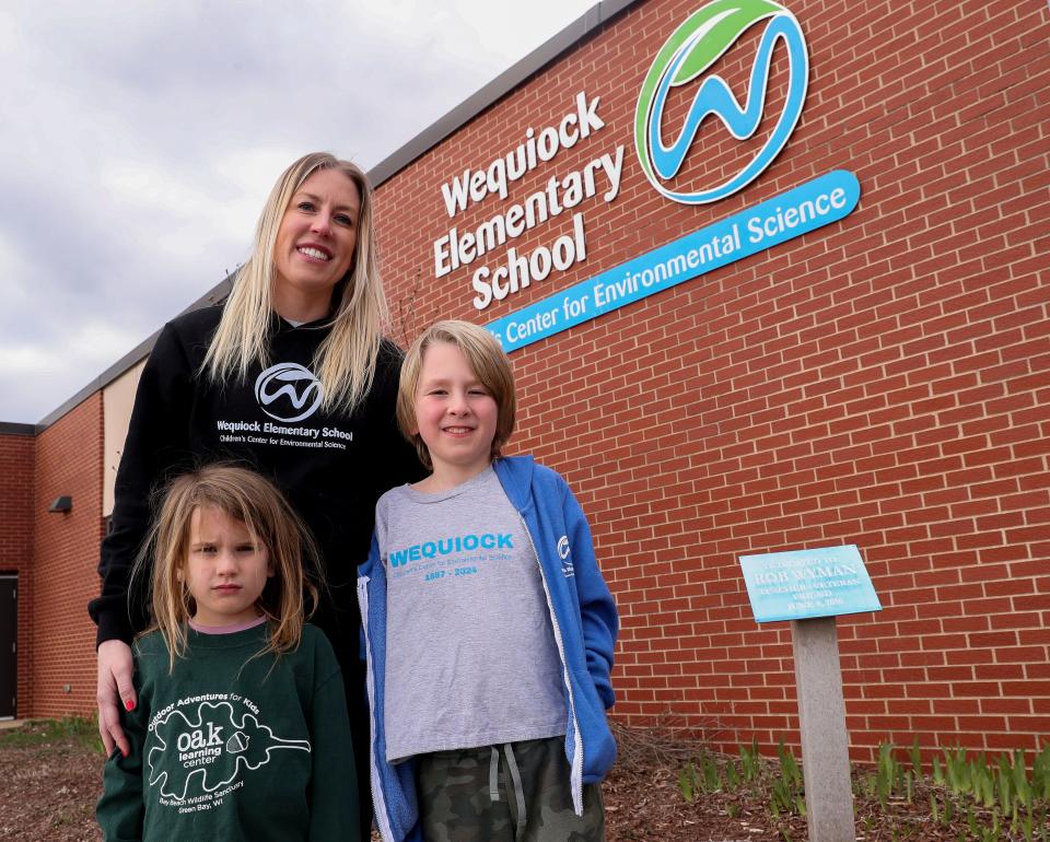 Leah Weakley and her children, Evelyn, 4, and Emerson, 7, pose for a portrait on March 19 at Wequiock Elementary School in Green Bay.