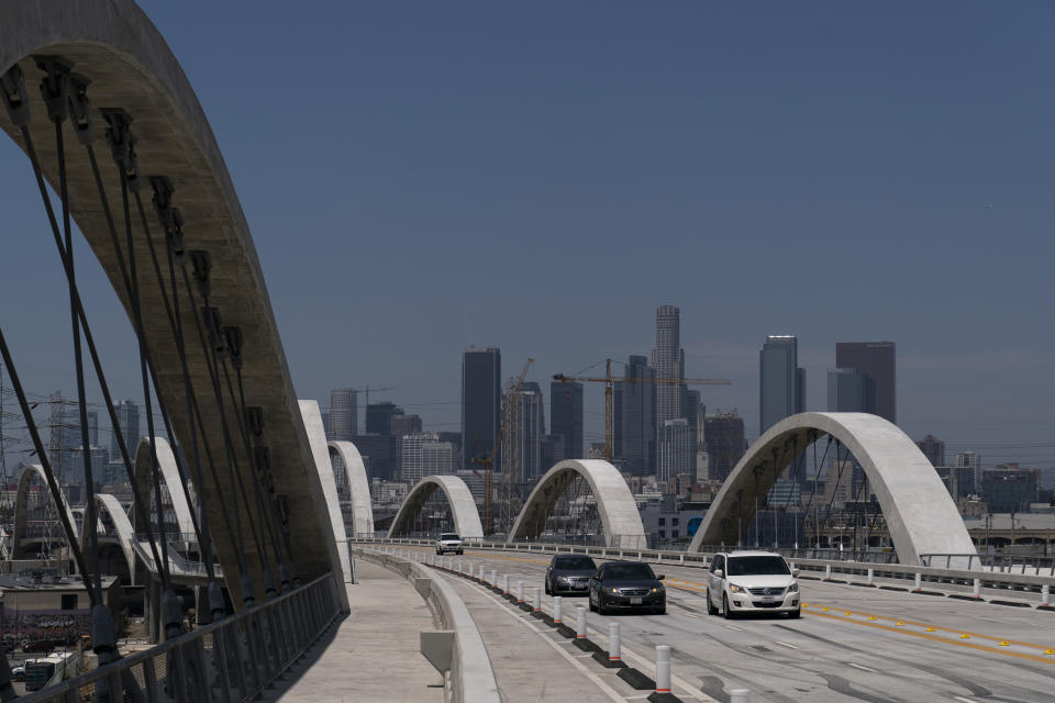 Cars move along the 6th Street Viaduct in Los Angeles, Wednesday, July 27, 2022. The newest bridge in Los Angeles, a $588-million architectural marvel with views of the downtown skyline, opened to great fanfare on July 10. It has already been closed, to great dismay, several times since then amid chaos and collisions. (AP Photo/Jae C. Hong)