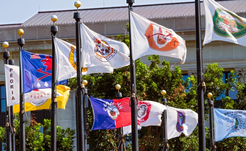 Tribal nation flags that fly north of the Oklahoma Capitol building are arranged in a circle by alphabetical order.