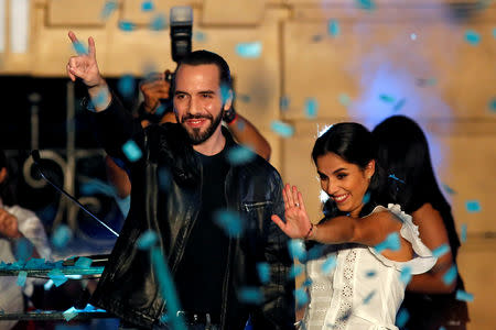 Presidential candidate Nayib Bukele of the Great National Alliance (GANA) and his wife Gabriela de Bukele gesture as they celebrate with supporters after the first official presidential election results were released in San Salvador, El Salvador, February 3, 2019. REUTERS/Jose Cabezas