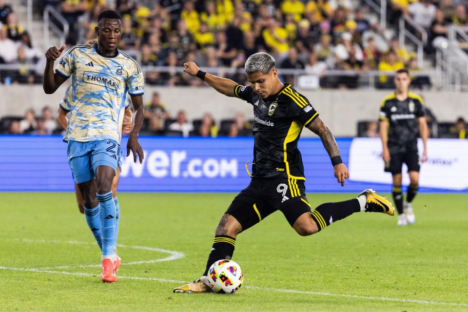 Oct 5, 2024; Columbus, Ohio, USA; Columbus Crew forward Cucho Hernandez (9) shoots the ball while Philadelphia Union midfielder Danley Jean Jacques (21) defends in the first half at Lower.com Field. Mandatory Credit: Trevor Ruszkowski-Imagn Images