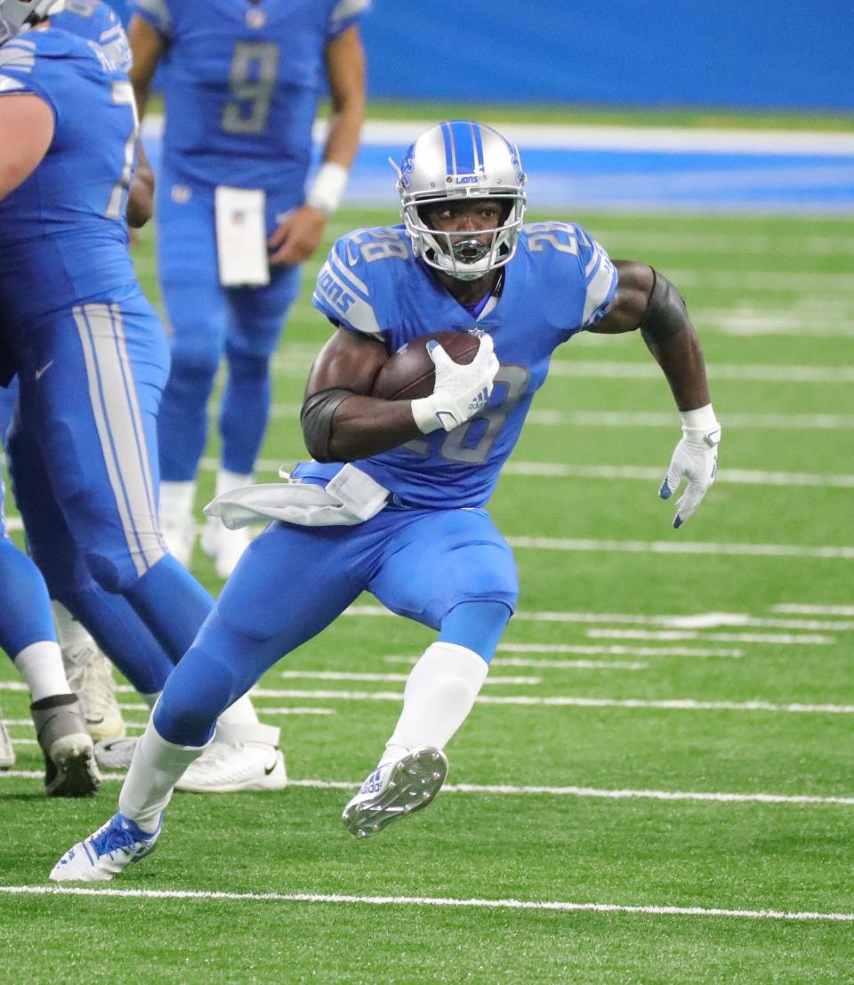 Lions running back Adrian Peterson runs for a first down against the Bears during the first half at Ford Field on Sunday, Sept. 13, 2020.