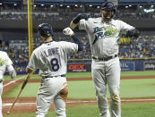 Tampa Bay Rays' Mike Zunino, right, celebrates his two-run home run with Brandon Lowe (8) during the fifth inning of a baseball game against the Miami Marlins, Saturday, Sept. 25, 2021, in St. Petersburg, Fla. (AP Photo/Steve Nesius)