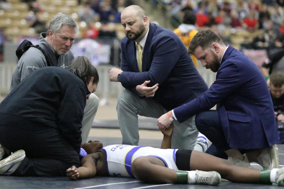 Clarksville Academy's Ty Bryant lays out on the mat after being slammed to the ground by Gibbs' Haley Redmond in the girls' 132-pound state title match during the TSSAA Division I State Wrestling Championships Saturday, Feb. 25, 2023 at the Williamson County Ag Expo in Franklin, Tennessee. Bryant was award the title after Redmond was disqualified.