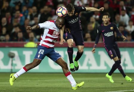 Football Soccer - Granada v Barcelona - Spanish La Liga Santander - Los Carmenes Stadium, Granada, Spain, 02/04/17 Barcelona's Jordi Alba (R) and Granada's Dimitri Foulquier in action. REUTERS/Pepe Marin