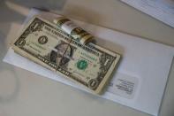 Tips, money collected from a customer donation fund and a last paycheck for employees laid off from Farley’s East cafe, that closed due to the financial crisis caused by the coronavirus disease (COVID-19), sits on a counter at the cafe in Oakland