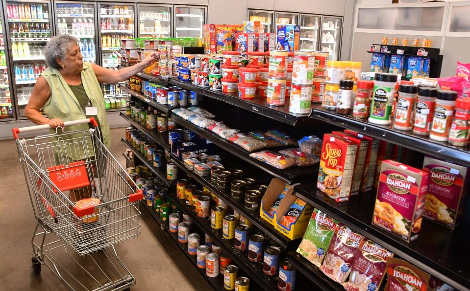 Marisel Luna does some shopping at the Evans Center and market, a vital hub in a low- to moderate-income area in Melbourne and Palm Bay.