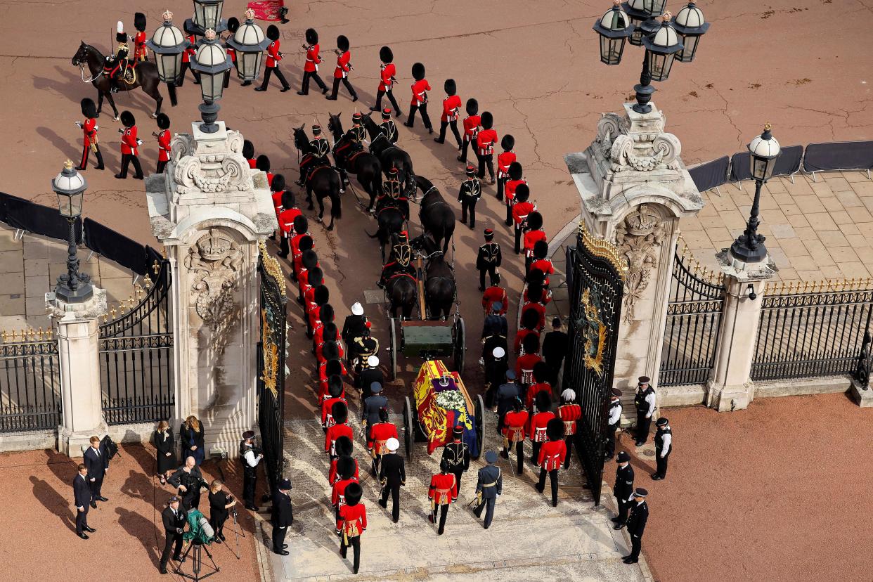 The coffin of Queen Elizabeth II, adorned with a Royal Standard and the Imperial State Crown and pulled by a Gun Carriage of The King's Troop Royal Horse Artillery, during a procession from Buckingham Palace to the Palace of Westminster, in London on September 14, 2022. - Queen Elizabeth II will lie in state in Westminster Hall inside the Palace of Westminster, from Wednesday until a few hours before her funeral on Monday, with huge queues expected to file past her coffin to pay their respects. (Photo by Chip Somodevilla / POOL / AFP) (Photo by CHIP SOMODEVILLA/POOL/AFP via Getty Images)