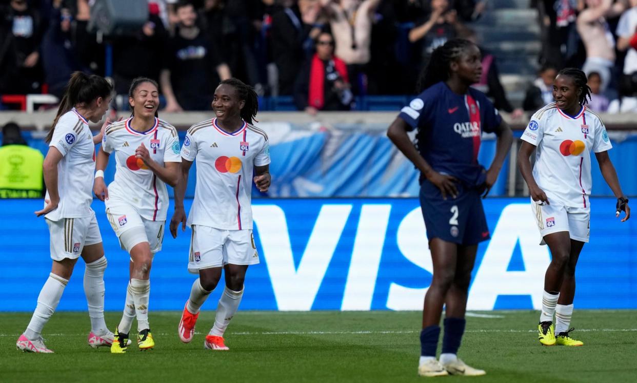 <span>Melchie Dumornay (third from left) celebrates scoring Lyon’s second goal against PSG, which sealed their place in the Women’s Champions League final.</span><span>Photograph: Thibault Camus/AP</span>