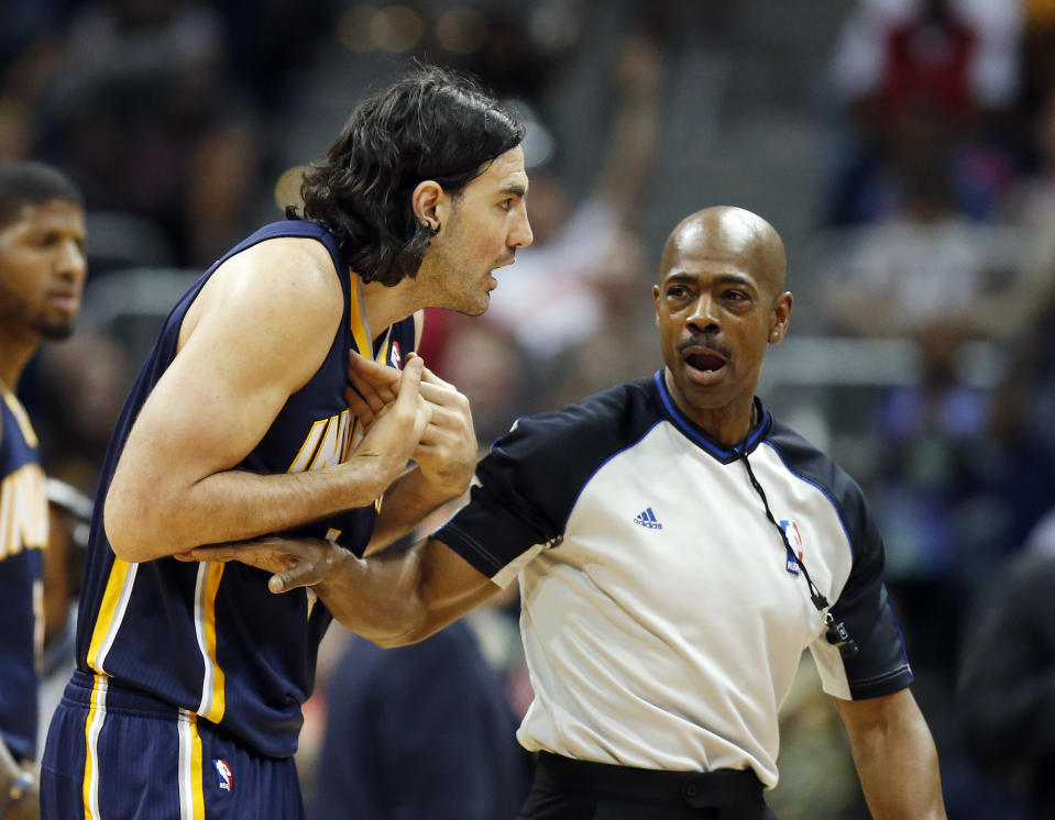 Indiana Pacers forward Luis Scola, left, argues with an official in the first half of Game 3 of an NBA basketball first-round playoff series against the Atlanta Hawks, Thursday, April 24, 2014, in Atlanta. (AP Photo/John Bazemore)