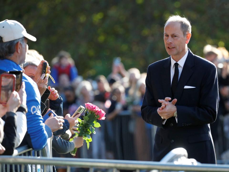 Britain's Prince Edward speaks with people gathered outside Windsor Castle, following the death of Britain's Queen Elizabeth, in Windsor, Britain, September 16, 2022