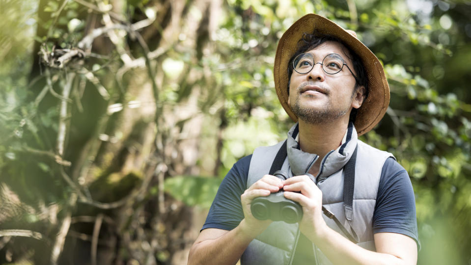 how to birdwatch: man birdwatching