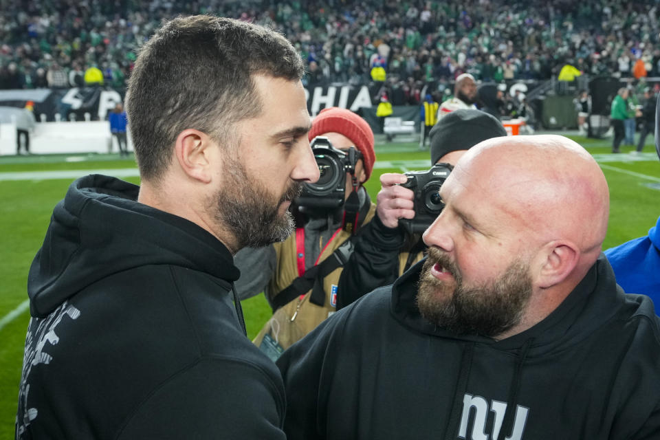 Philadelphia Eagles head coach Nick Sirianni and New York Giants head coach Brian Daboll meet on the field after an NFL football game Monday, Dec. 25, 2023, in Philadelphia. The Eagles won. (AP Photo/Matt Rourke)