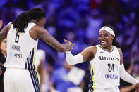 Dallas Wings forward Natasha Howard (6) and guard Arike Ogunbowale (24) celebrate a lead over the Chicago Sky during a WNBA basketball game, Wednesday, May 15, 2024, in Arlington, Texas. Dallas won 87-79. (AP Photo/Brandon Wade)