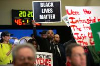 Protestors take over the stage forcing Democratic presidential hopeful Minnesota Senator Amy Klobuchar to cancel her rally before it even started on March 1, 2020 in St. Louis Park, west of Minneapolis, Minnesota. - Hundreds of Klobuchar supporters witnessed a group of Black Lives Matter protesters demanding her to drop out of the race after her misshandling of Myon Burrell's case in 2002 when she was County Attorney. (Photo by Kerem Yucel / AFP) (Photo by KEREM YUCEL/AFP via Getty Images)