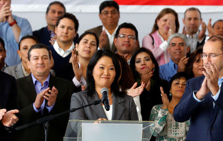 Peruvian presidential candidate Keiko Fujimori accompanied by elected congressmen gives a speech to the media after Peru's electoral office ONPE said she lost against Pedro Pablo Kuczynski in the country's presidential election, at her party's headquarters in Lima, Peru, June 10, 2016. REUTERS/Mariana Bazo