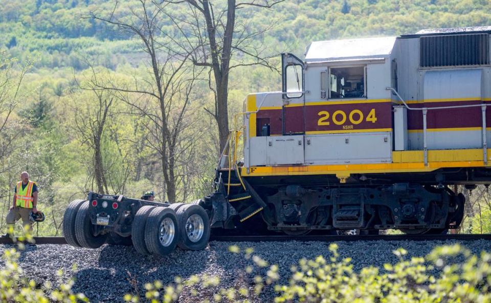 Emergency crews respond after a dump truck was hit by a train on Thursday, May 2, 2024 in Worth Township.