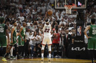 Jimmy Butler (22) makes one of three free throws with 3.0 seconds left for a one-point Heat lead before Boston Celtics Derrick White grabbed a rebound and scored as time expired during the second half of Game 6 of the NBA basketball Eastern Conference finals to beat the Heat 104-103, Saturday, May 27, 2023, in Miami. (AP Photo/Michael Laughlin)
