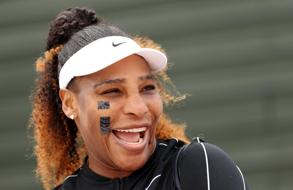 Serena Williams (pictured) shares a laugh during practice at Wimbledon.