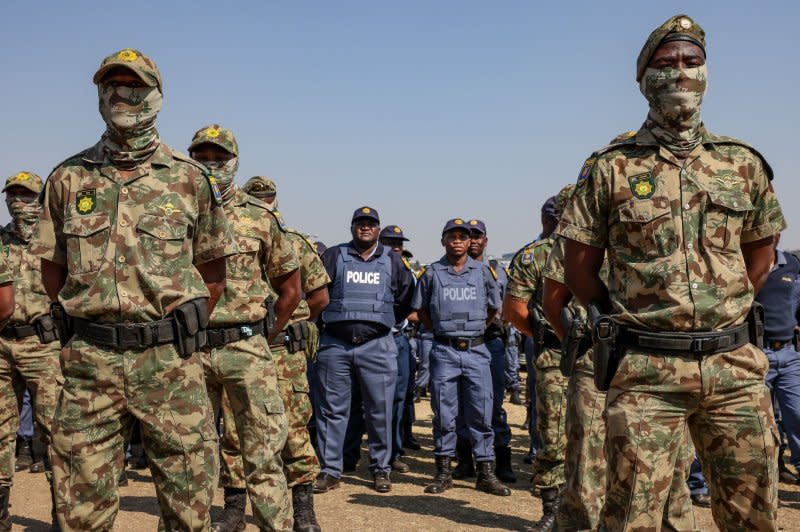 Members of the South African Special Task Force and Police Force stand in formation. Photo by Jemal Countess/UPI