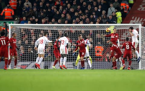 Crystal Palace's James Tomkins (right) scores his side's second goal of the game during the Premier League match at Anfield, Liverpool. PRESS ASSOCIATION Photo. Picture date: Saturday January 19, 2019. See PA story SOCCER Liverpool. Photo credit should read: Darren Staples/PA Wire. RESTRICTIONS: EDITORIAL USE ONLY No use with unauthorised audio, video, data, fixture lists, club/league logos or "live" services. Online in-match use limited to 120 images, no video emulation. No use in betting, games or single club/league/player publications - Credit: PA