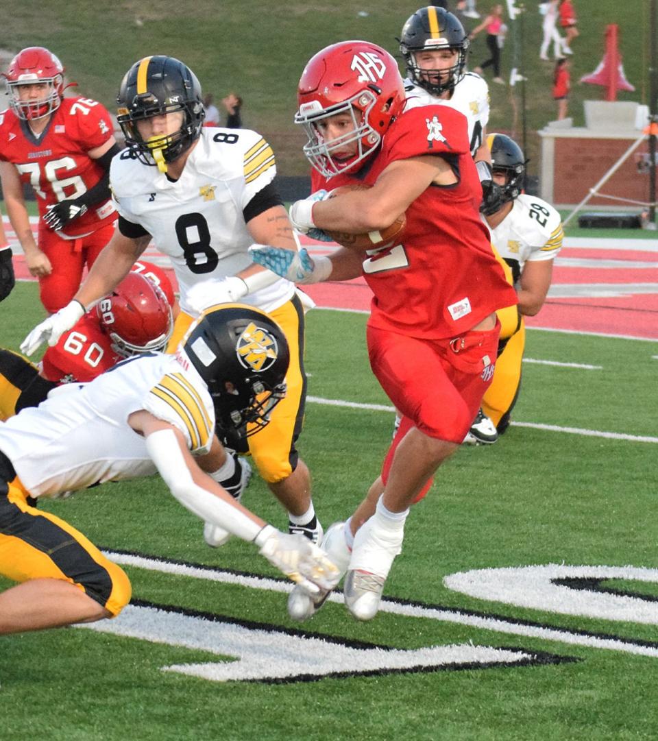 Johnstown's Kaynen Lindsey attempts to break outside against the Watkins Memorial defense on Friday.