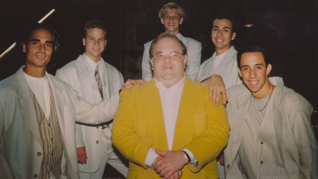 Lou Pearlman, center, with the members of Backstreet Boys. From left: Kevin Richardson, Brian Littrell, Nick Carter, Howie Dorough and AJ McLean