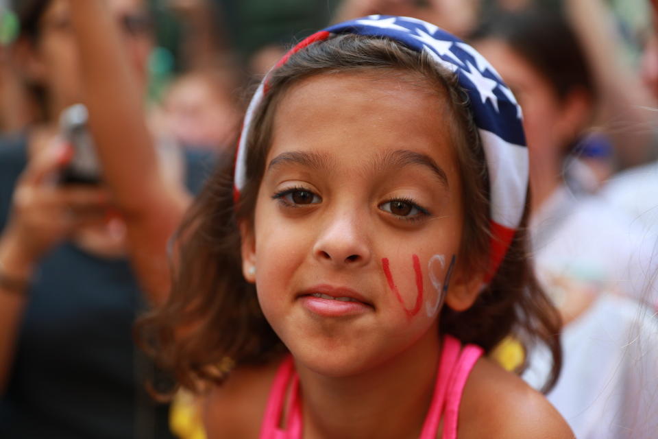 A fan has her face painted as she came out to celebrate the U.S. women's soccer team pass by during a ticker tape parade along the Canyon of Heroes, Wednesday, July 10, 2019, in New York. (Photo: Gordon Donovan/Yahoo News) 