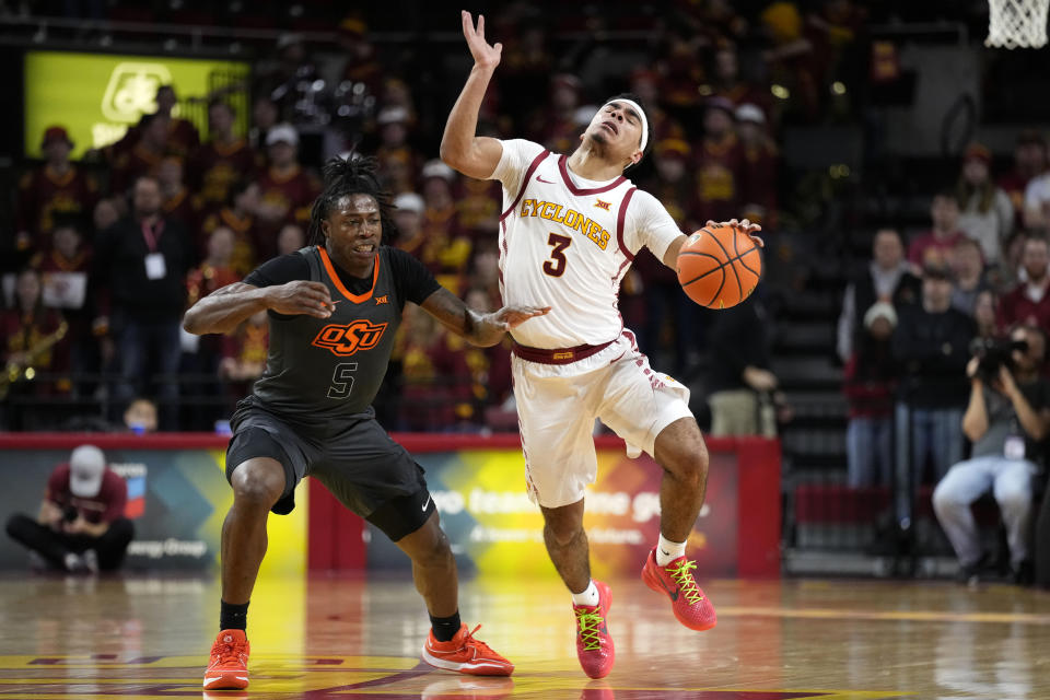 Iowa State guard Tamin Lipsey (3) drives up court past Oklahoma State guard Quion Williams (5) during the second half of an NCAA college basketball game, Saturday, Jan. 13, 2024, in Ames, Iowa. Iowa State won 66-42. (AP Photo/Charlie Neibergall)