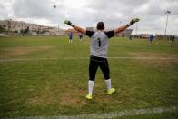 A player from Ariel Municipal Soccer Club, which is affiliated with Israel Football Association, trains ahead of a match against Maccabi HaSharon Netanya at Ariel Municipal Soccer Club's training grounds in the West Bank Jewish settlement of Ariel September 23, 2016. Picture taken September 23, 2016. REUTERS/Amir Cohen