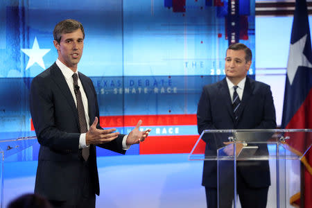 FILE PHOTO: U.S. Rep. Beto O'Rourke speaks as U.S. Senator Ted Cruz (R) looks on, during a debate at the KENS-5 Studios in San Antonio, Texas, U.S., October 16, 2018. Tom Reel/San Antonio Express-News/Pool via REUTERS/File Photo