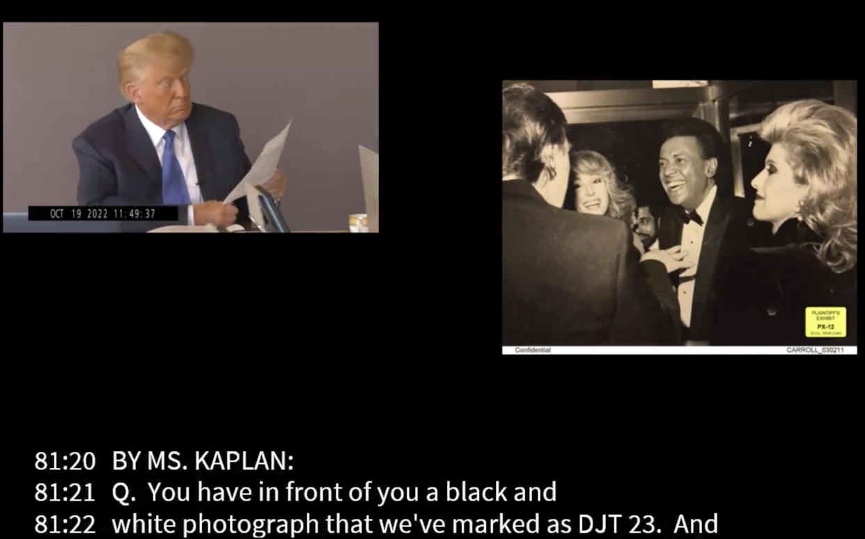 In this image taken from video released by Kaplan Hecker & Fink, former President Donald looks at a photograph, presented as evidence during his Oct. 19, 2022 deposition, that shows E. Jean Carroll, second from left, and her then-husband John Johnson meeting Trump and his wife Ivanka at an event in the 1980s. In his deposition, Trump mistook Carroll as Marla Maples, his now ex-wife, when shown the image. The video recording of Trump being questioned about the rape allegations against him was made public for the first time Friday, May 5, 2023, providing a glimpse of the Republican's emphatic, often colorful denials. (Kaplan Hecker & Fink via AP)