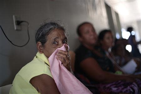 Patients wait for the arrival of Cuban doctor Dania Rosa Alvero Pez, who works at the Health Center at the city of Jiquitaia in the state of Bahia, north-eastern Brazil, November 18, 2013. REUTERS/Ueslei Marcelino