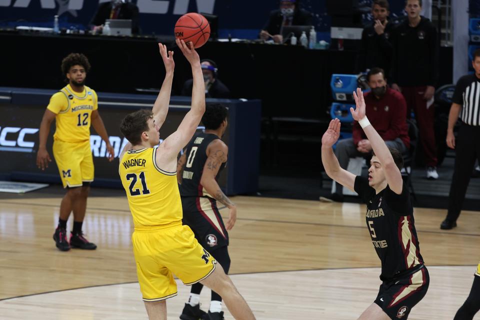 Michigan Wolverines guard Franz Wagner (21) shoots the ball against Florida State Seminoles center Balsa Koprivica (5) in the first half during the Sweet 16 of the 2021 NCAA Tournament at Bankers Life Fieldhouse on March 28, 2021.
