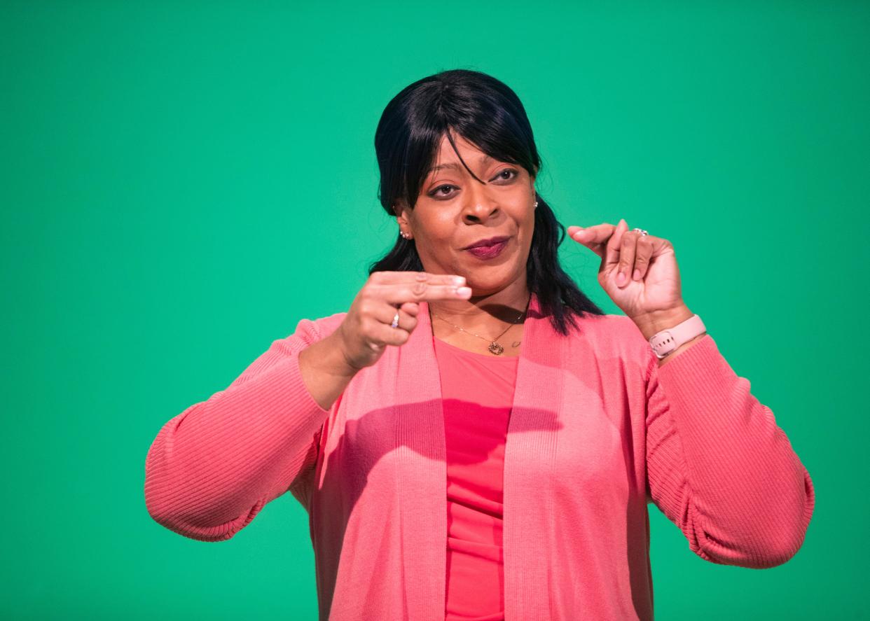 Brenda Cash, American Sign Language (ASL) interpreter,  translates for the press conference dealing with COVID-19 Thursday, Oct. 14, 2021.