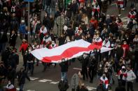 Belarusian opposition supporters hold a rally in Minsk