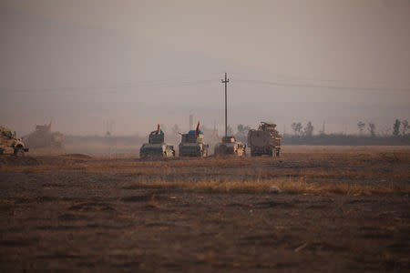 Military vehicles of Peshmerga forces drives towards the town of Bashiqa, east of Mosul, during an operation to attack Islamic State militants in Mosul, Iraq, November 7, 2016. REUTERS/Azad Lashkari