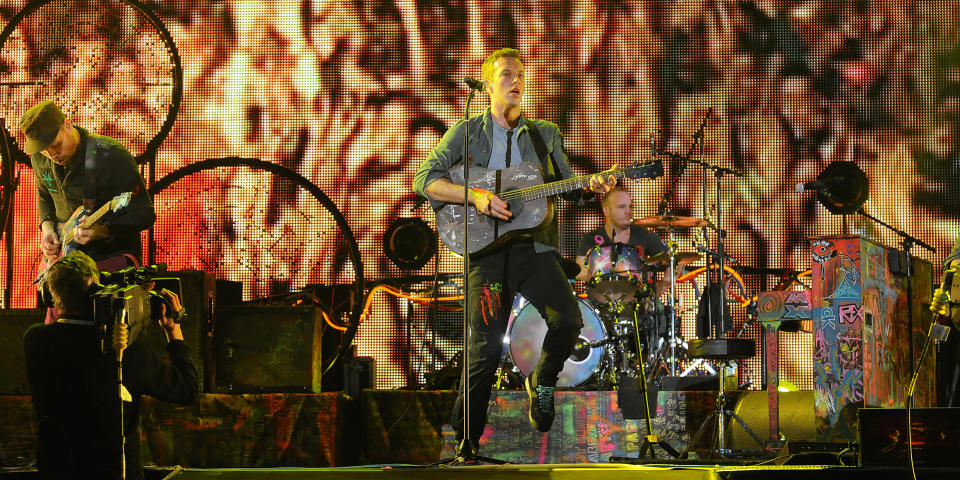 The band performing their classic hit Yellow – the second track they played on the night. Shortly before taking to the stage a helicopter had flown from the direction of the luxurious Emirates Palace Hotel low over the eager audience, presumably carrying the four Brits. Photograph: Peter Harrison/Yahoo! Maktoob