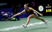 Tennis - Singapore WTA Finals Singles - National Indoor Stadium, Singapore - 23/10/16 - Simona Halep of Romania in action against Madison Keys of the U.S. REUTERS/Edgar Su