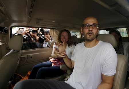 FILE PHOTO: Canadian teacher Neil Bantleman sits beside his wife Tracy shortly after his release from Cipinang prison in Jakarta