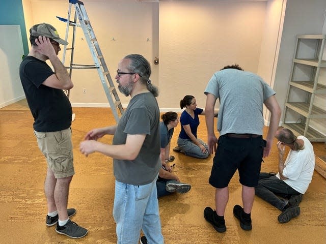 Workers at the ART theater prepare to kick off the 2023-24 season on Aug.18.