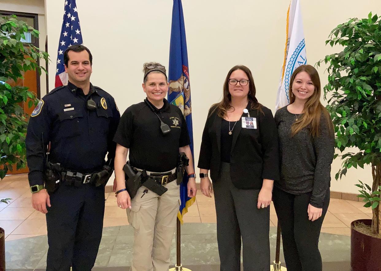 From left, the full-time members of the Crisis Intervention Team: Holland police officer Austin Engerson, Ottawa County Sheriff's Office deputy Michele Sampson, Ottawa County Community Mental Health clinician Amanda Sheffield, OCCMH clinician Frankie Badur.
