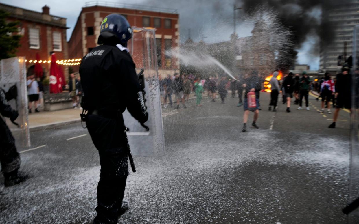 Protesters attacked police in riot gear