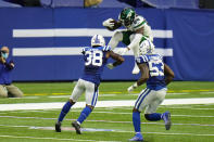 New York Jets running back Kalen Ballage (29) tries to leap over Indianapolis Colts running back Jonathan Taylor (28) and outside linebacker Darius Leonard (53) in the second half of an NFL football game in Indianapolis, Sunday, Sept. 27, 2020. (AP Photo/AJ Mast)