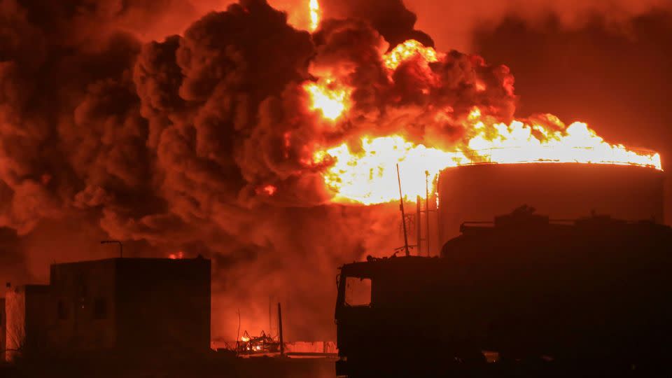 Oil tanks burn at the port in Hodeidah, Yemen, Saturday, July 20, 2024, following an Israeli strike. - AP