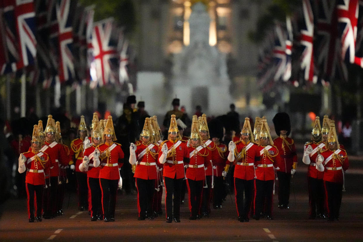 Ceremonial troops march from Buckingham Palace to the Palace of Westminster during a rehearsal for tomorrow's ceremonial procession.