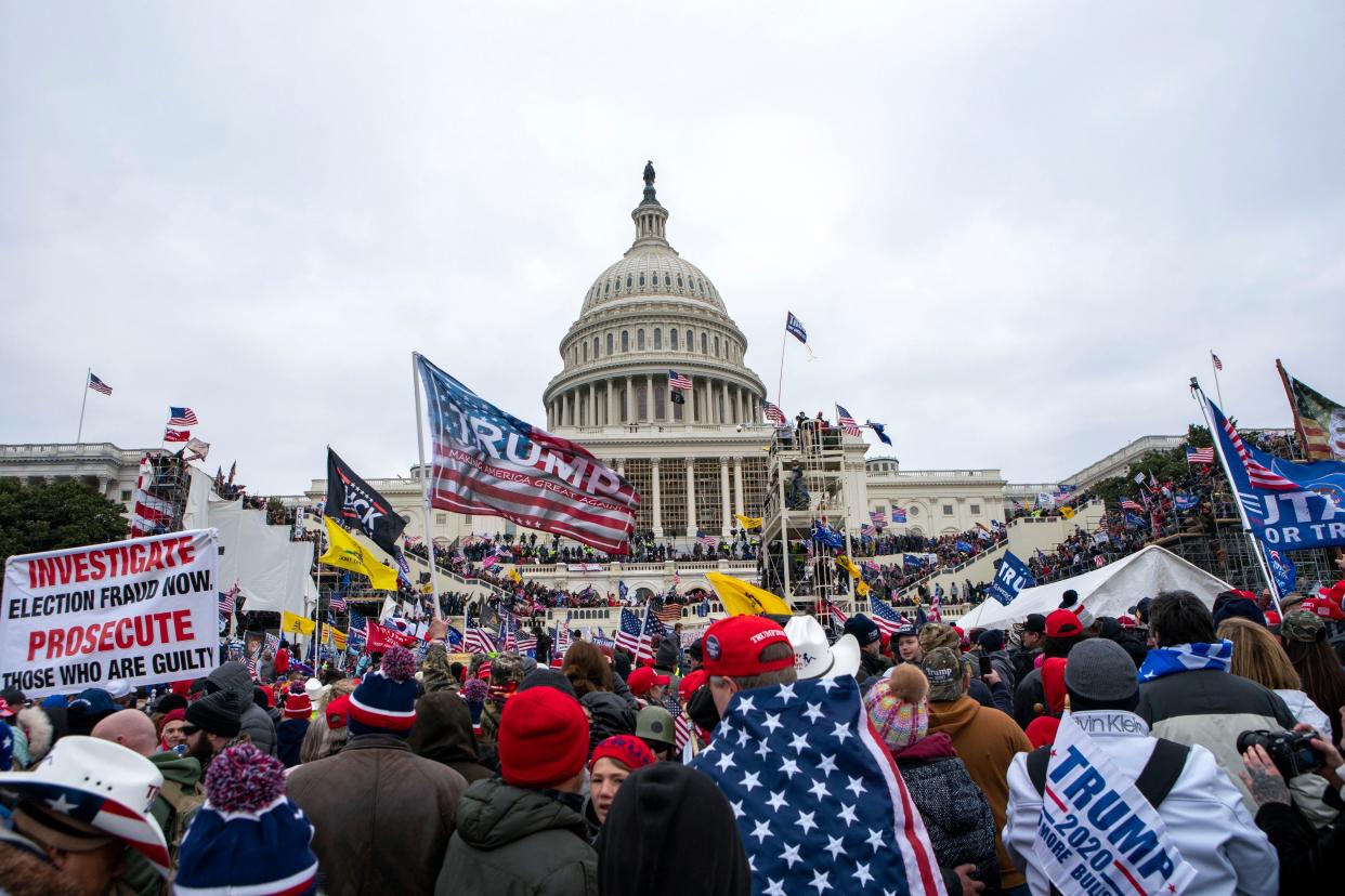 FILE - Rioters loyal to President Donald Trump rally at the U.S. Capitol in Washington on Jan. 6, 2021. 