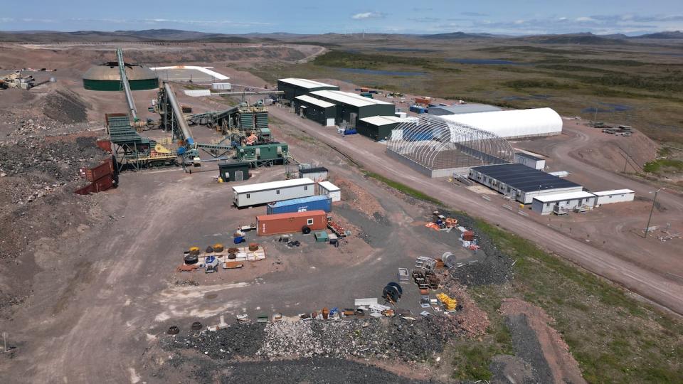 The new owners of the St. Lawrence fluorspar mine are pledging to invest $100 million over the next three years to restart and expand the site, which closed in February 2022 after the former owners ran out of cash. (Danny Arseanault/CBC - image credit)